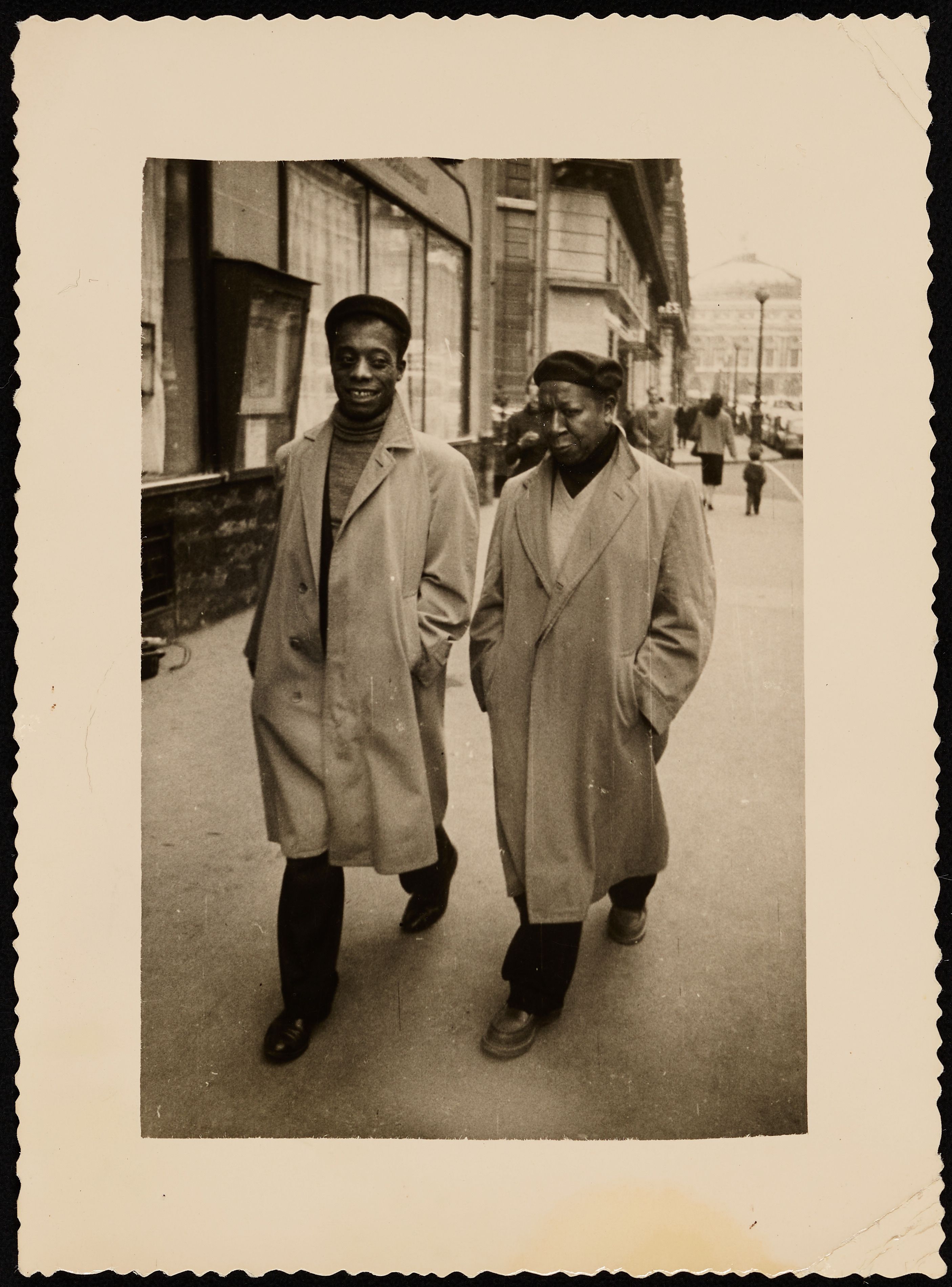 Beauford Delaney and James Baldwin walking together